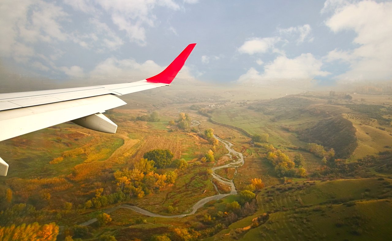 The Georgian countryside from a plane with the wing visible.