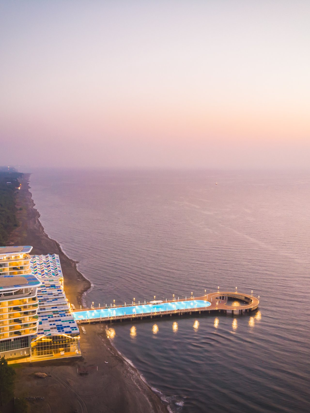 A beachfront resort with pool extending into the water in Shekvetili, Georgia.