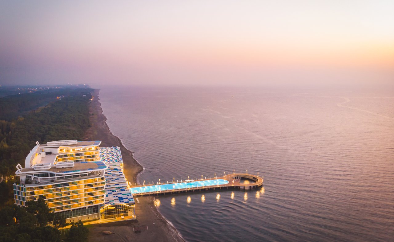 A beachfront resort with pool extending into the water in Shekvetili, Georgia.