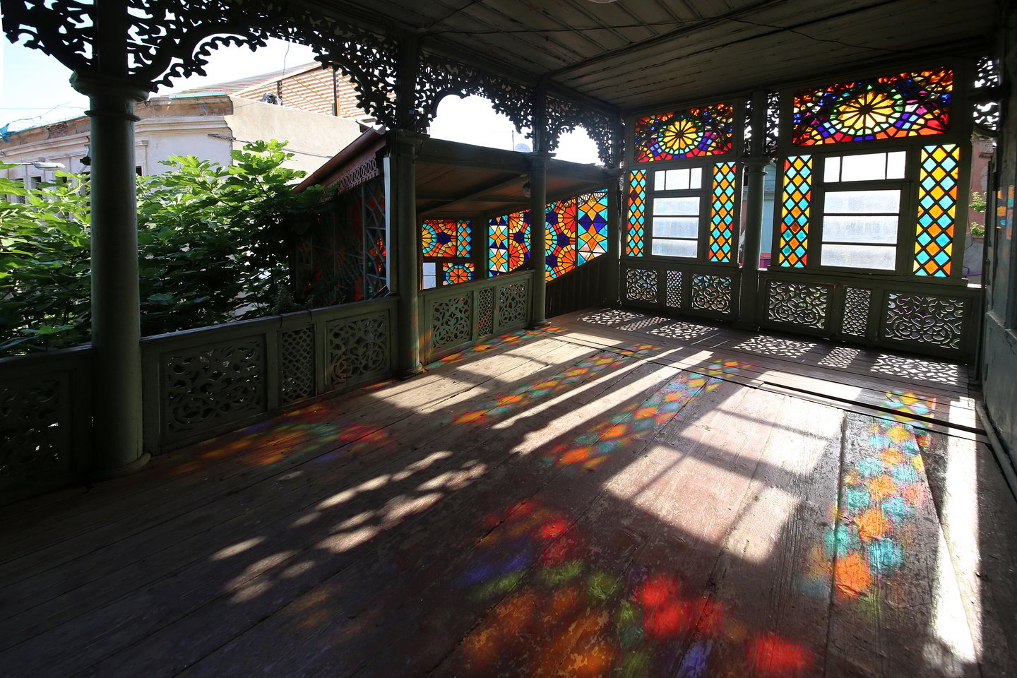 A balcony with stained glass windows at the Kaleidoscope House in Tbilisi, Georgia.
