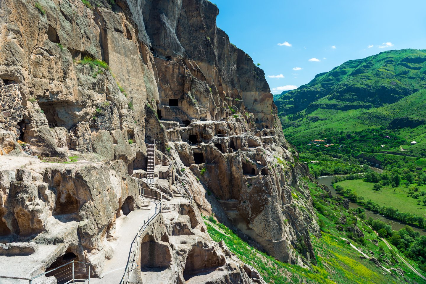 The exterior of the Vardzia Cave City on the edge of a cliff in Georgia.