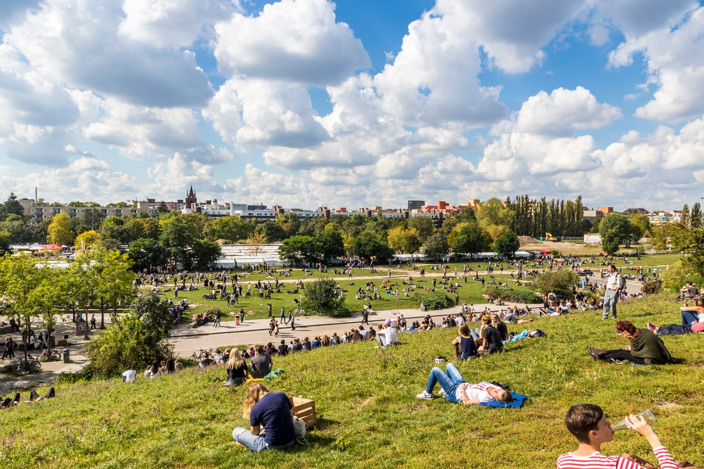 People relaxing in Mauerpark, Berlin on a sunny day