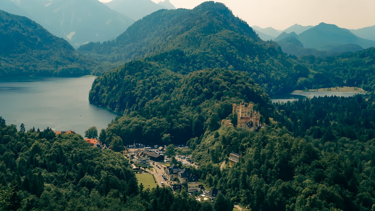 Looking down from Neuschwanstein Castle at the view of mountains and lakes