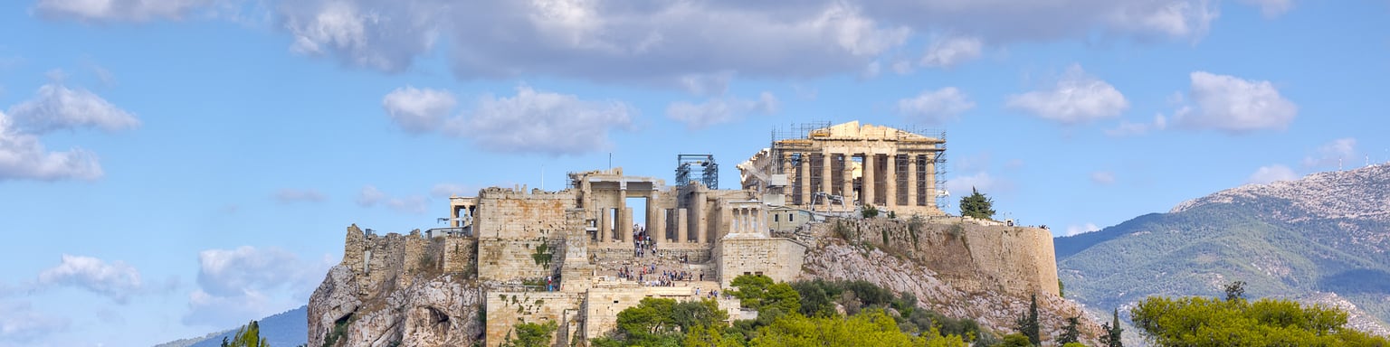 A view of the Acropolis over the treetops.