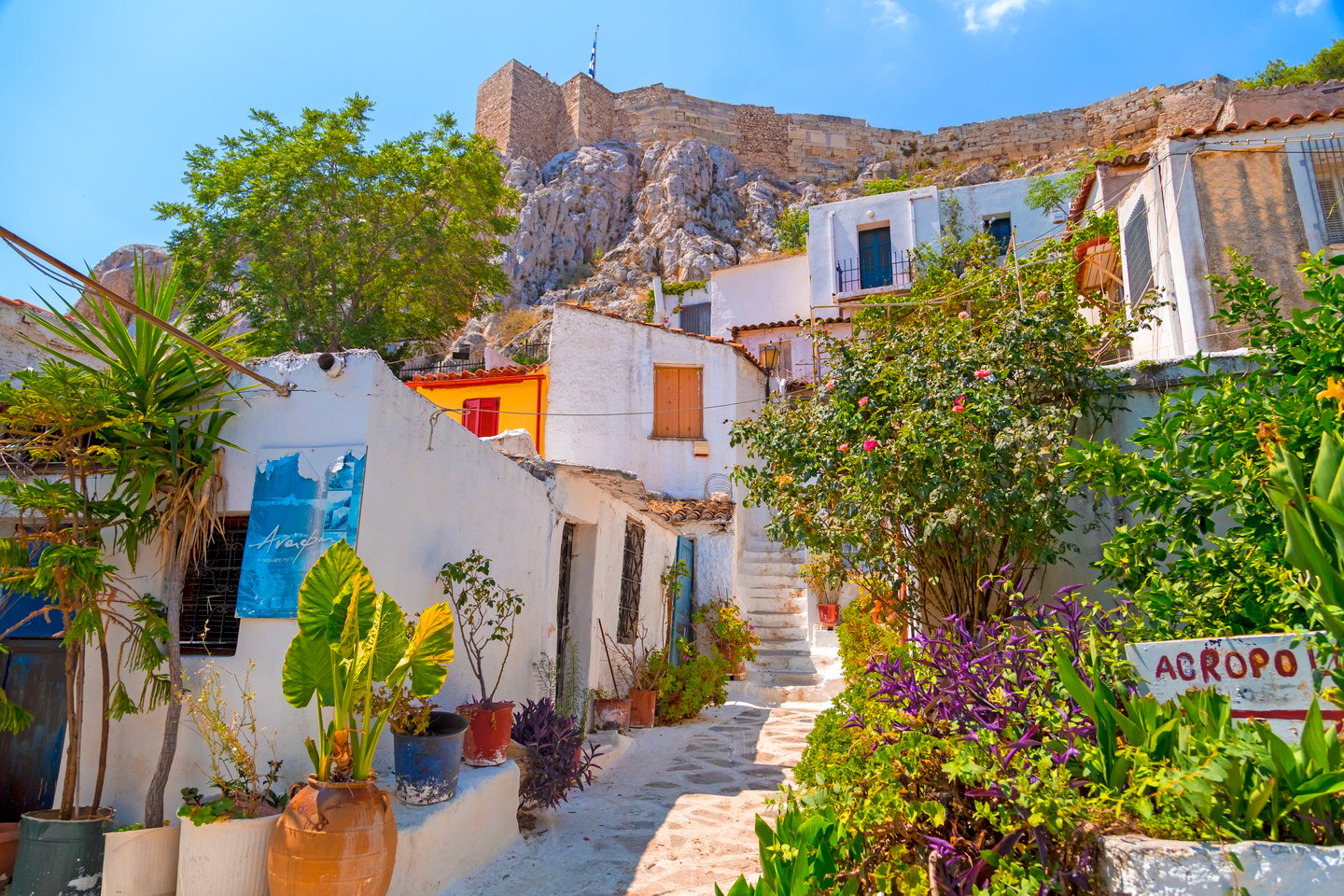 White houses and colouful flowers in Anafiotika, Athens.