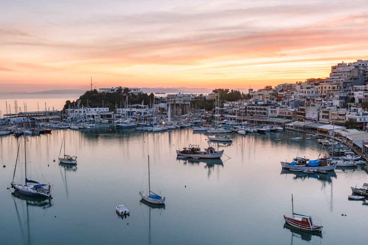 The sun setting over the Mikrolimano Harbour in Athens