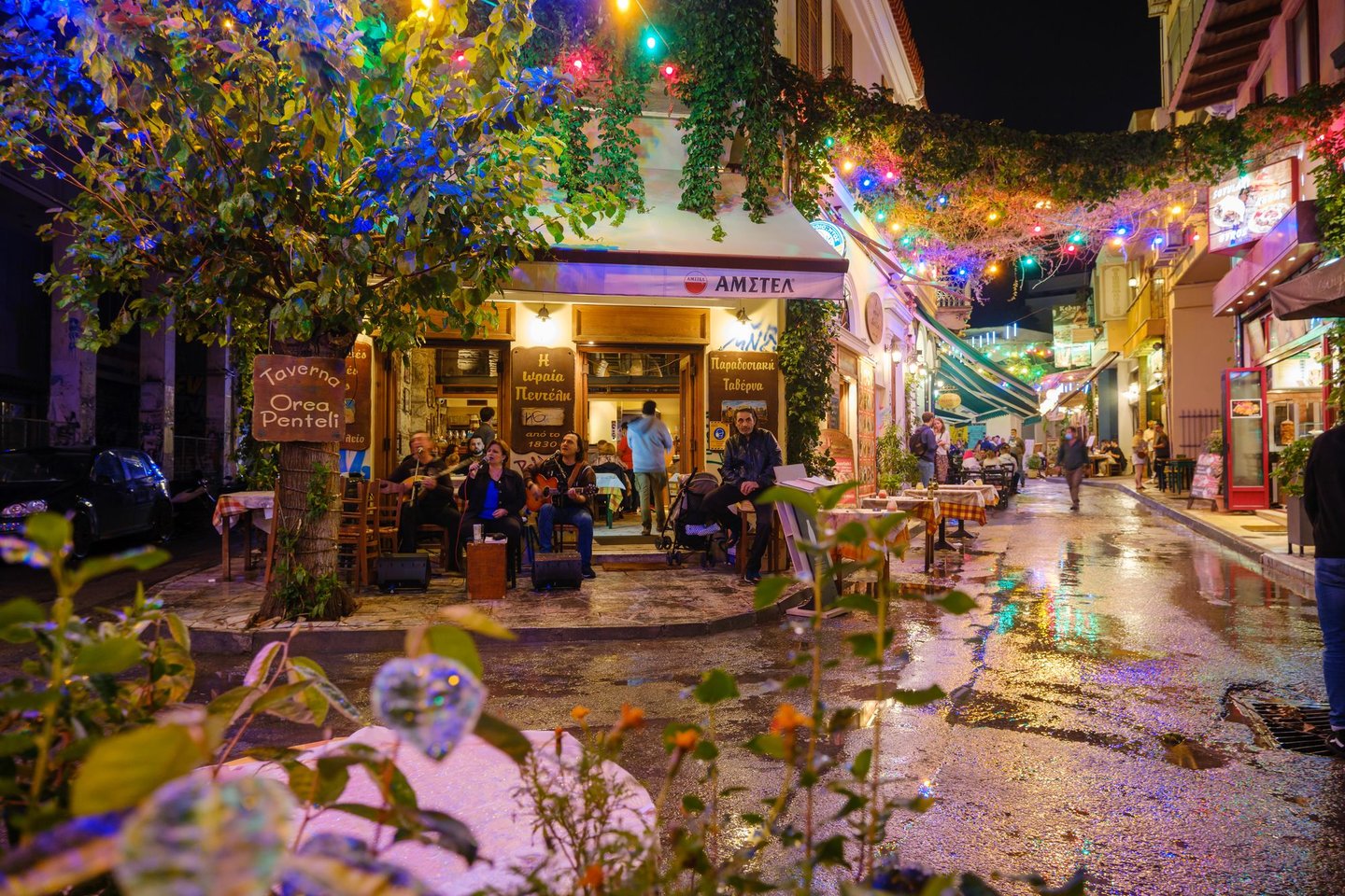 People sitting at a bar in Psiri, Athens.