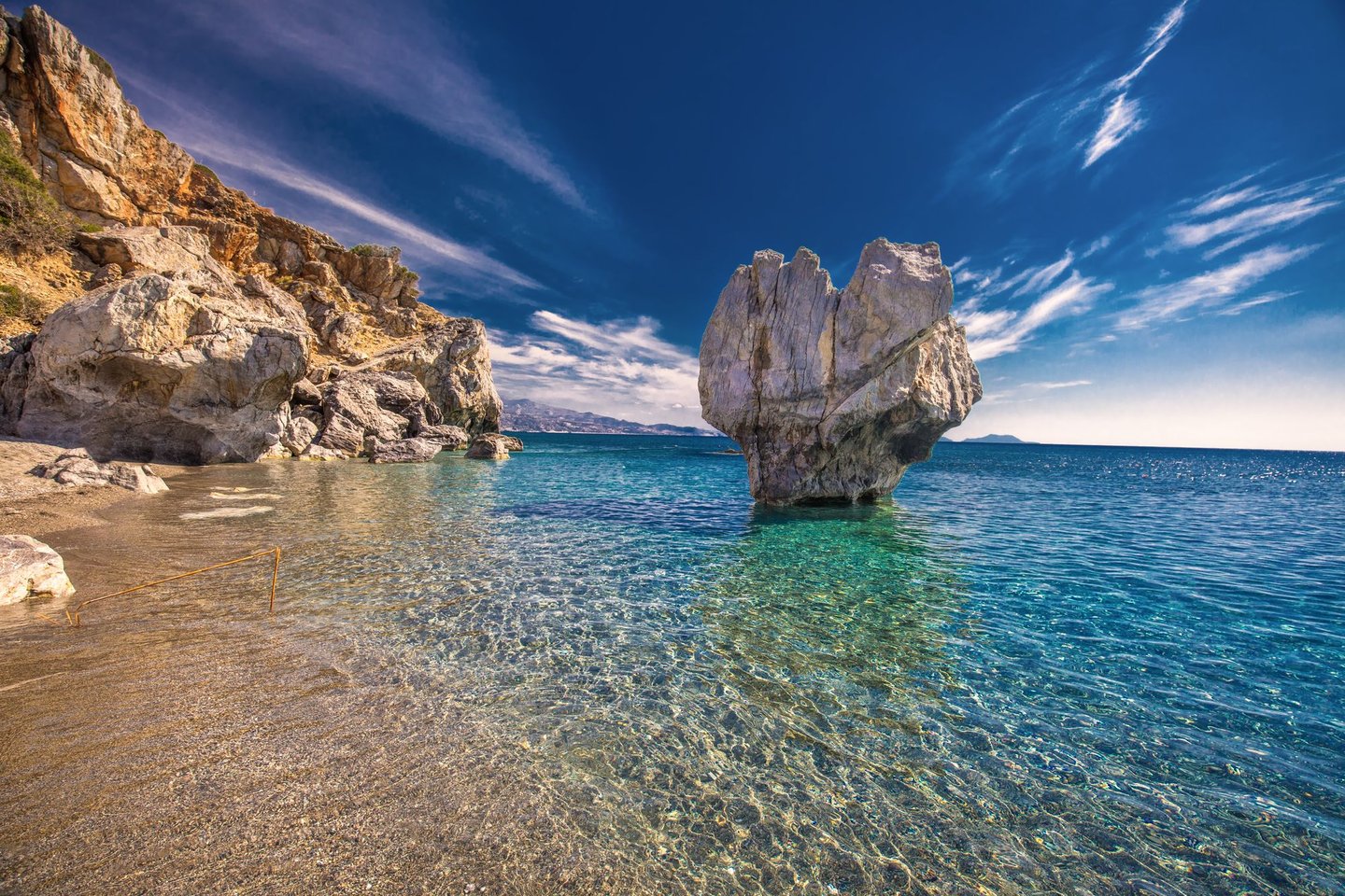 Huge rocks and turquoise water at Preveli Beach, Crete.