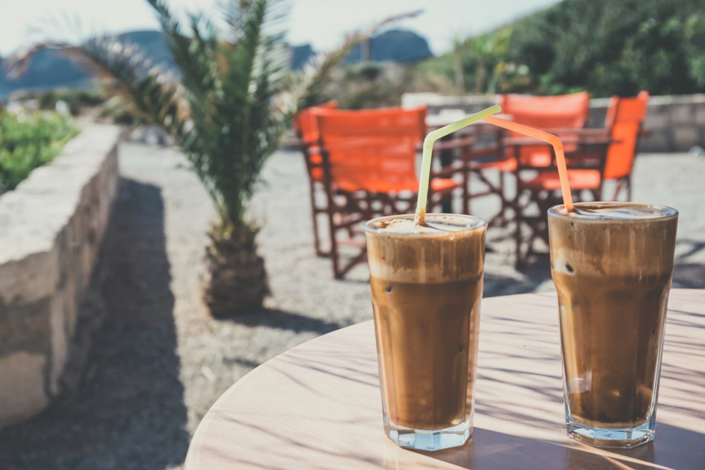 Two frappes (iced coffees) in Greece on a sunny day.