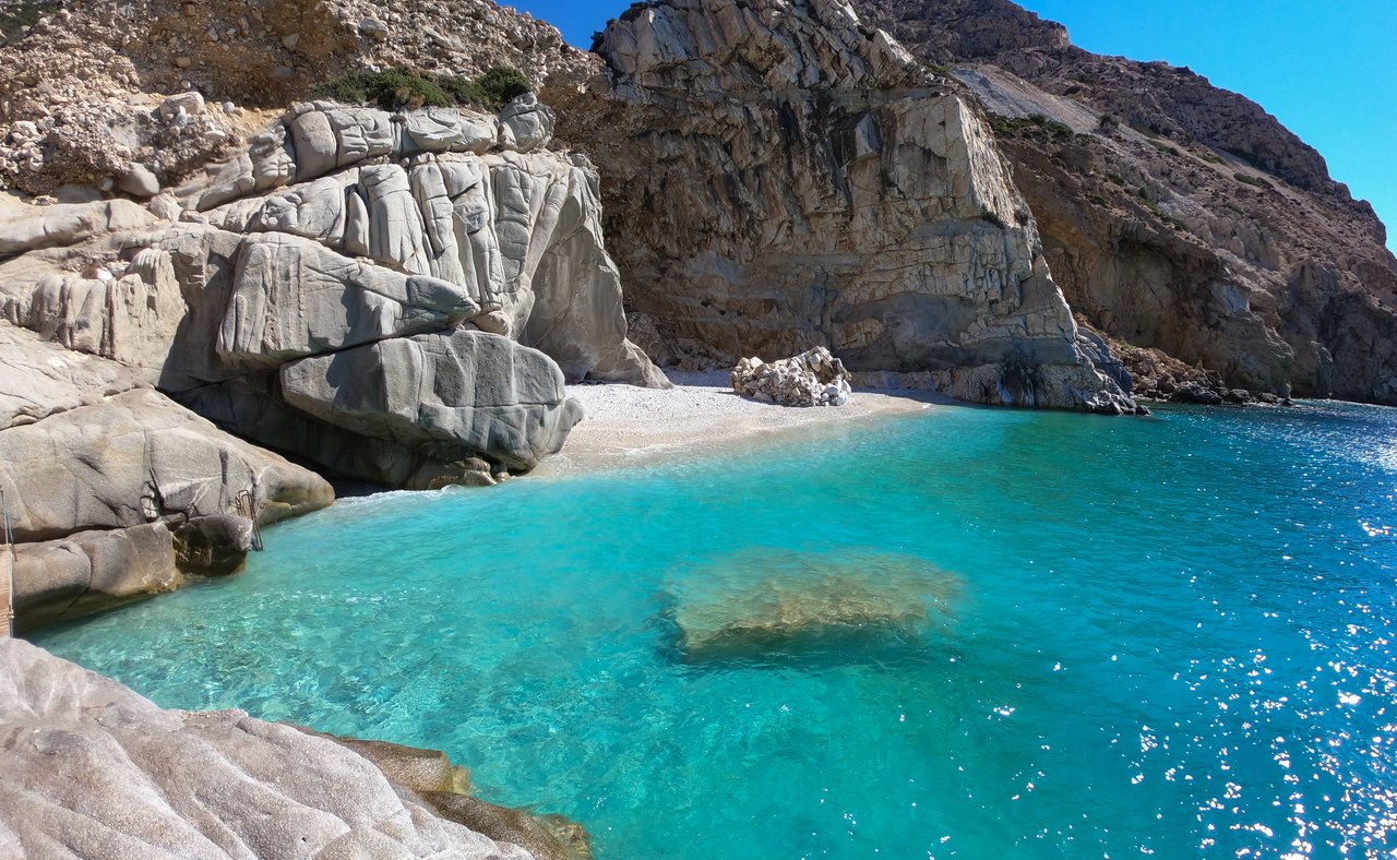 The beautiful Seychelles Beach, lined with rocks in Ikaria, Greece.