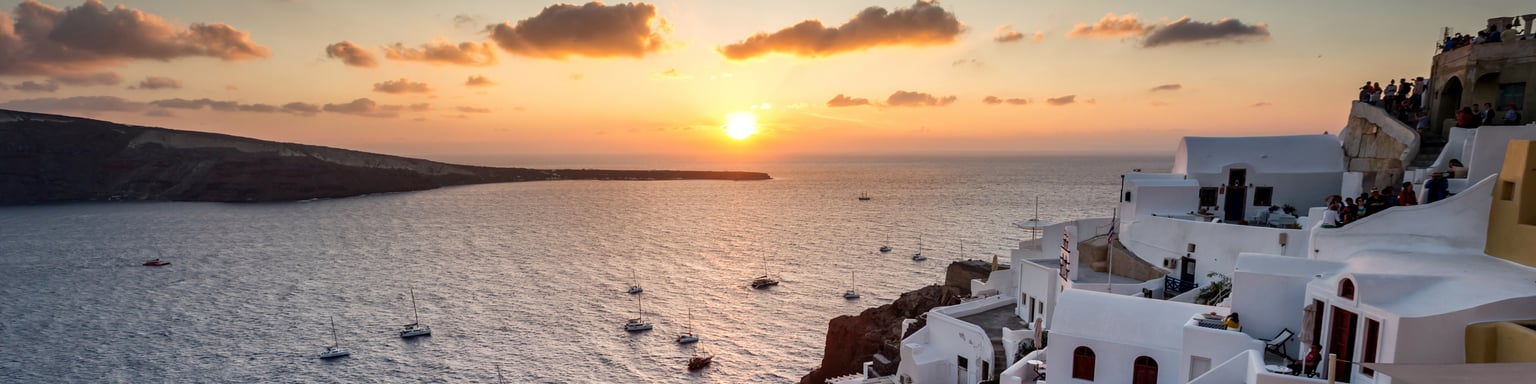 The setting sun over the caldera in Santorini, Greece