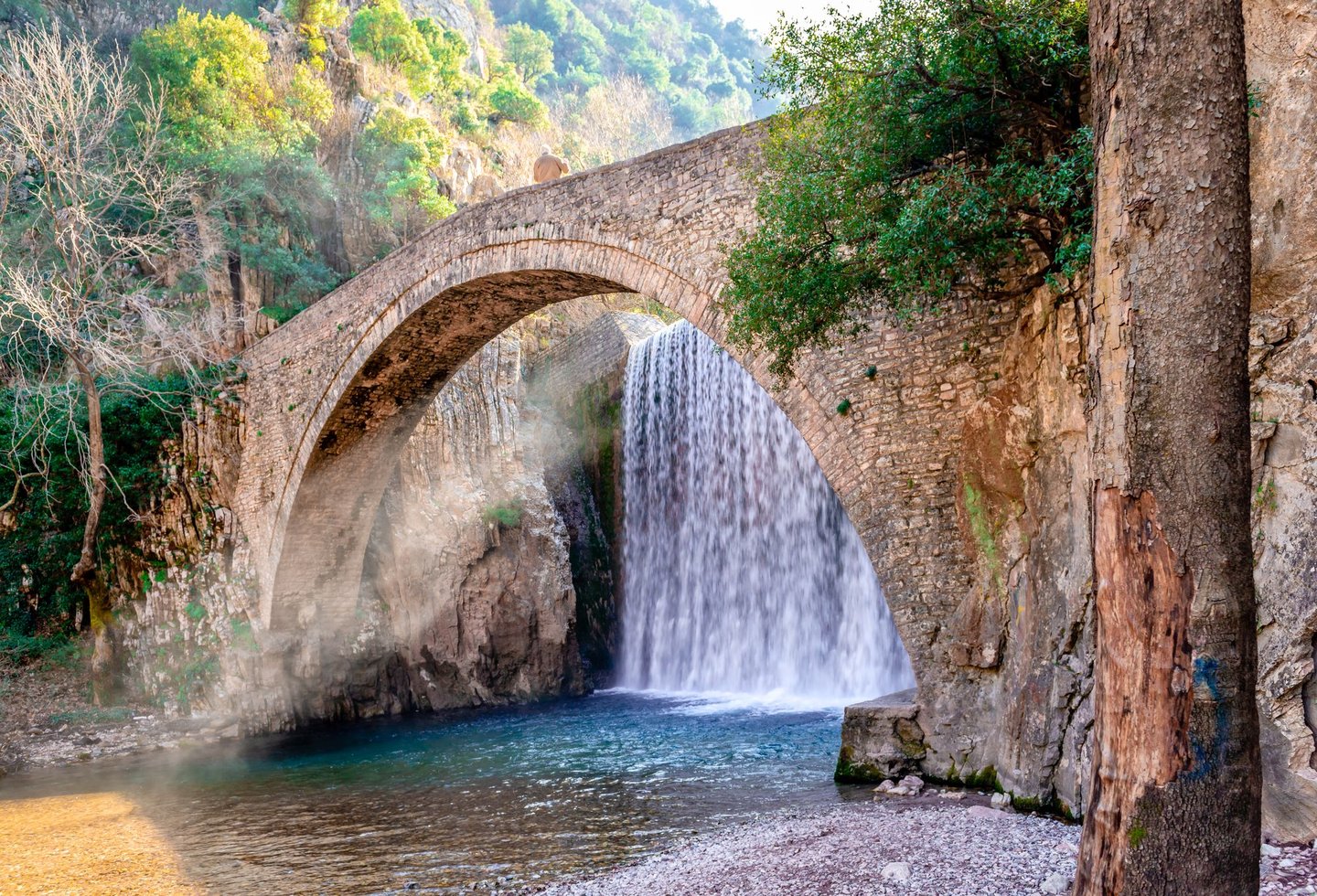 The artificial waterfall and the medieval stone bridge of Palaiokarya, in Trikala, Thessaly, Greece