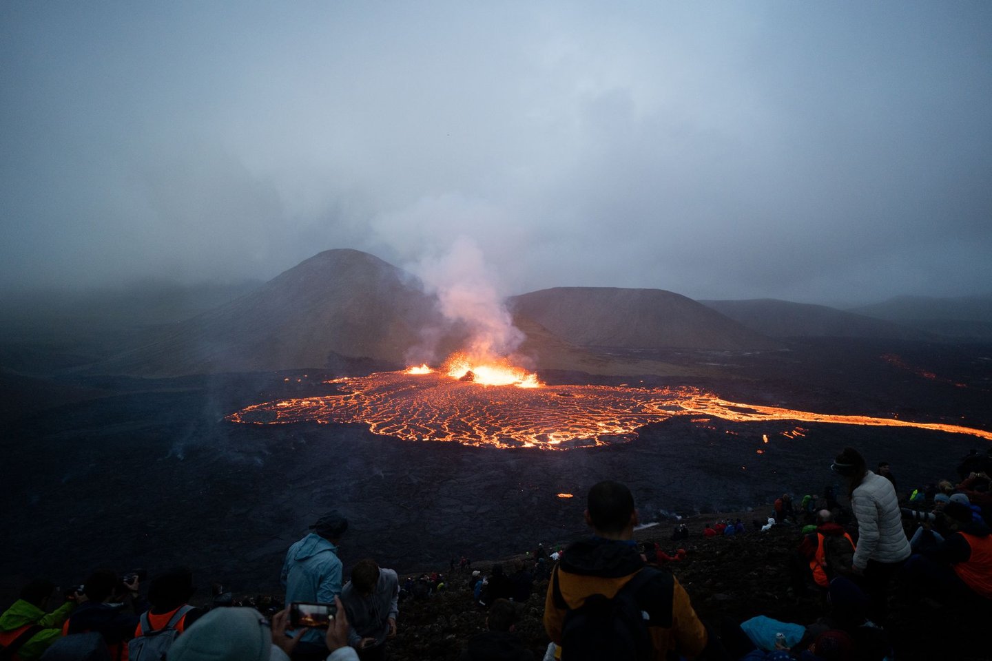 Hikers watching the Meradalir Eruption of Fagradalsfjall Volcano in Iceland 2022