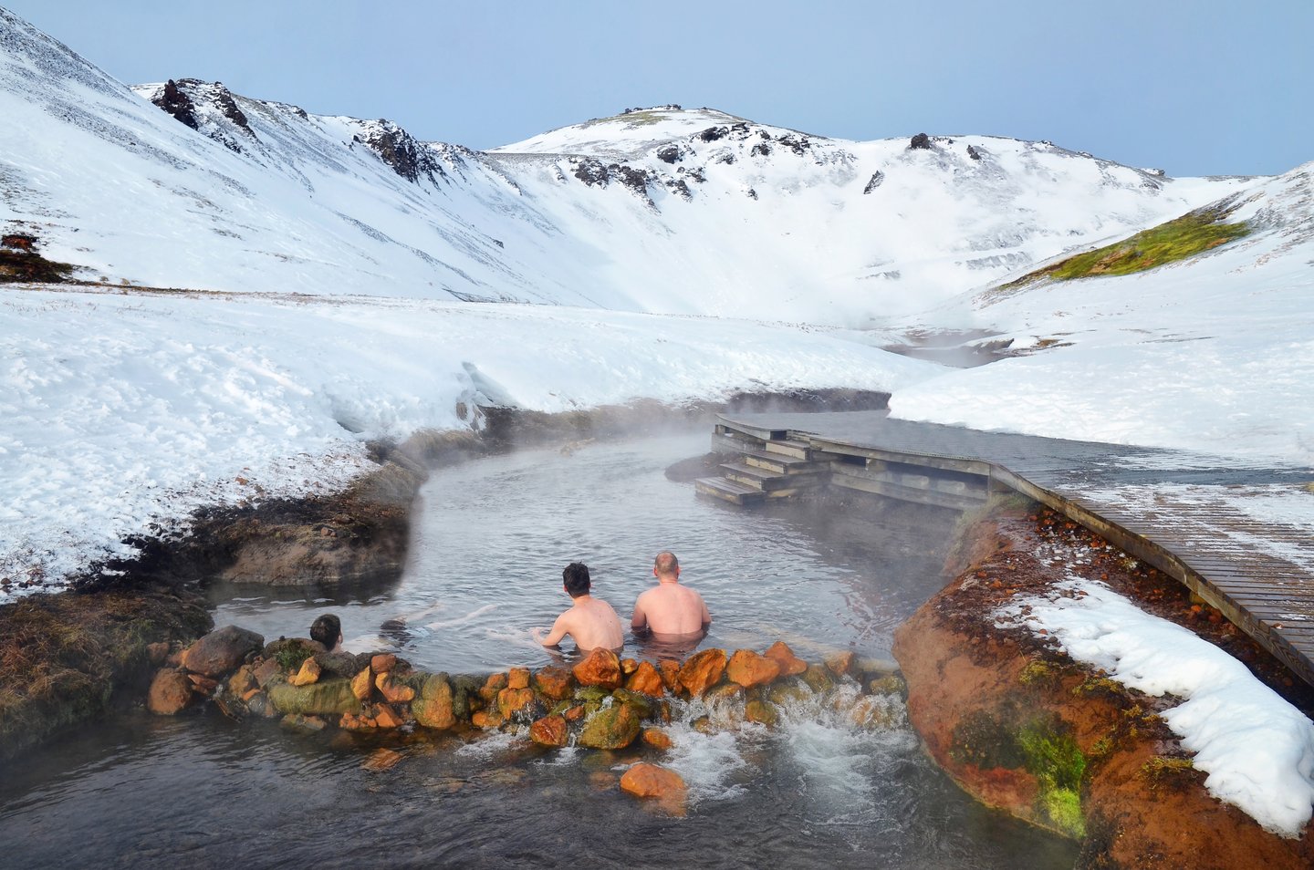 People bathing in the Reykjadalur Thermal Pools, Iceland