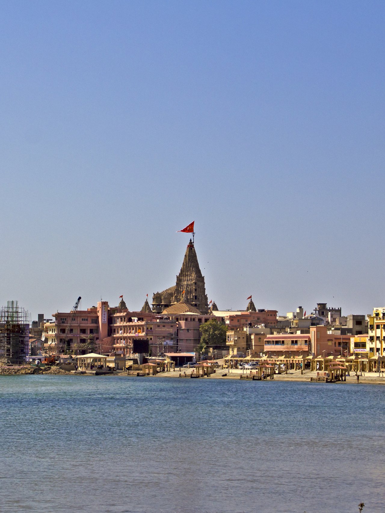 The embankment of the sacred town Dwarka with the ancient Krishna Dwarkadhish temple