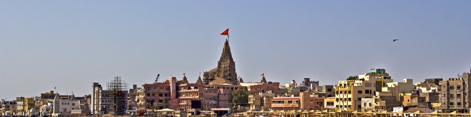 The embankment of the sacred town Dwarka with the ancient Krishna Dwarkadhish temple
