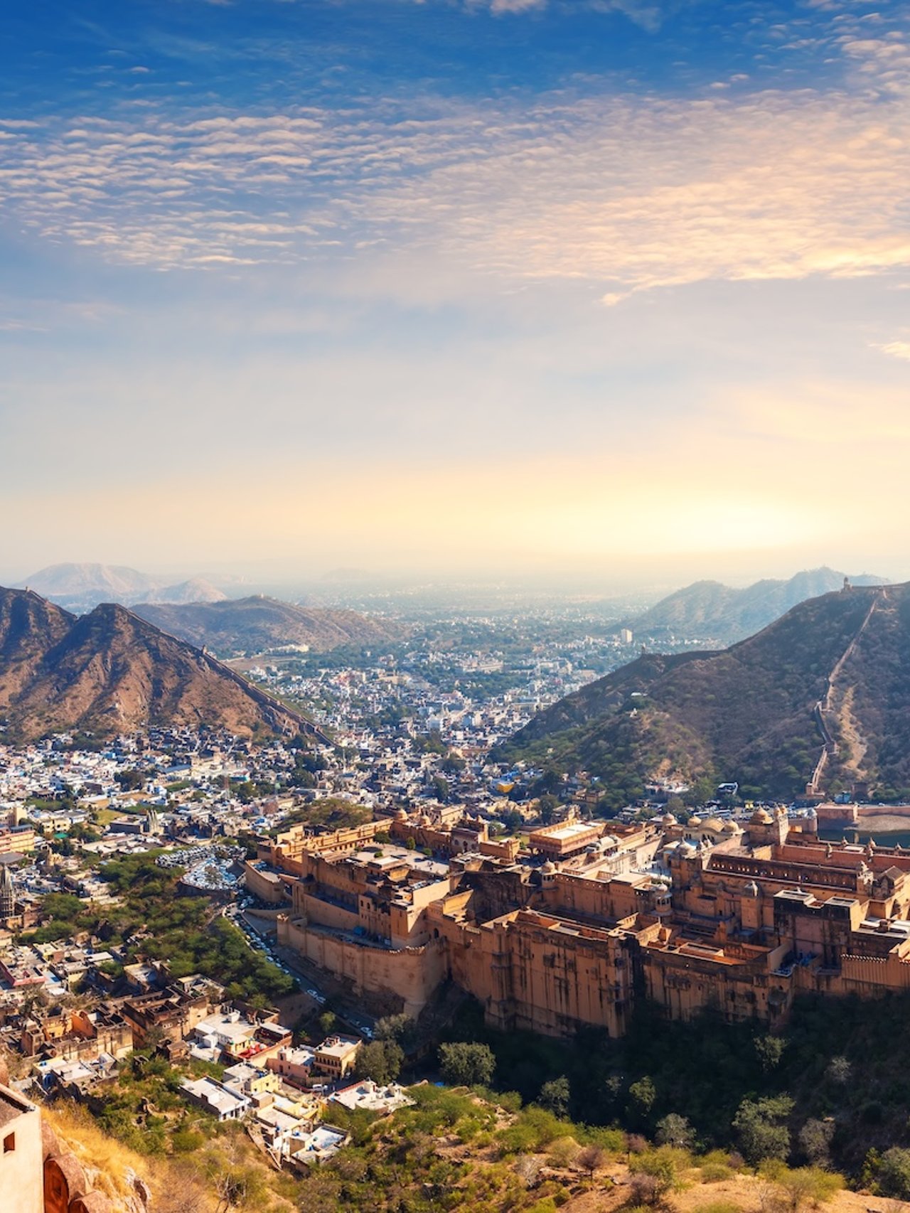 A panoramic view Amber Fort, Maotha Lake and the Aravalli Range in Jaipur, India