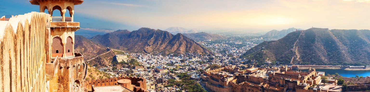 A panoramic view Amber Fort, Maotha Lake and the Aravalli Range in Jaipur, India
