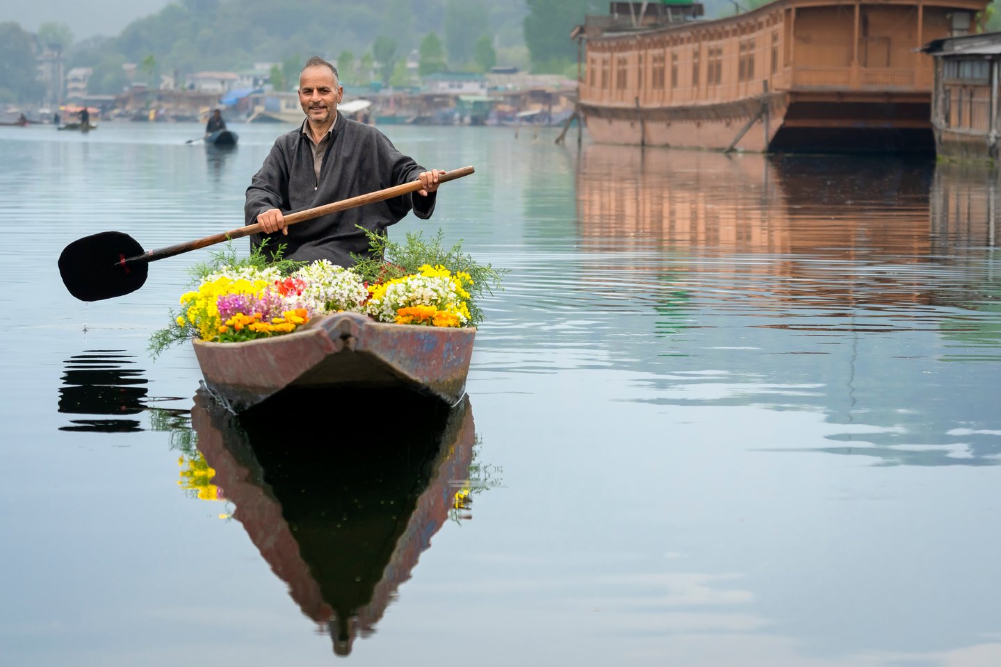 Man selling flowers from his boat on Lake Dal