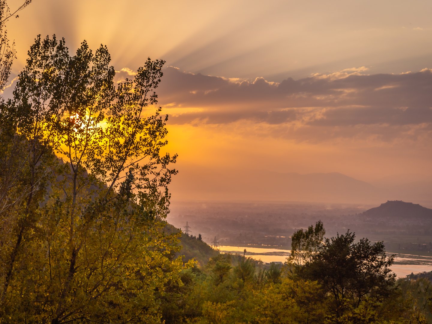 The sun setting over Lake Dal in Kashmir