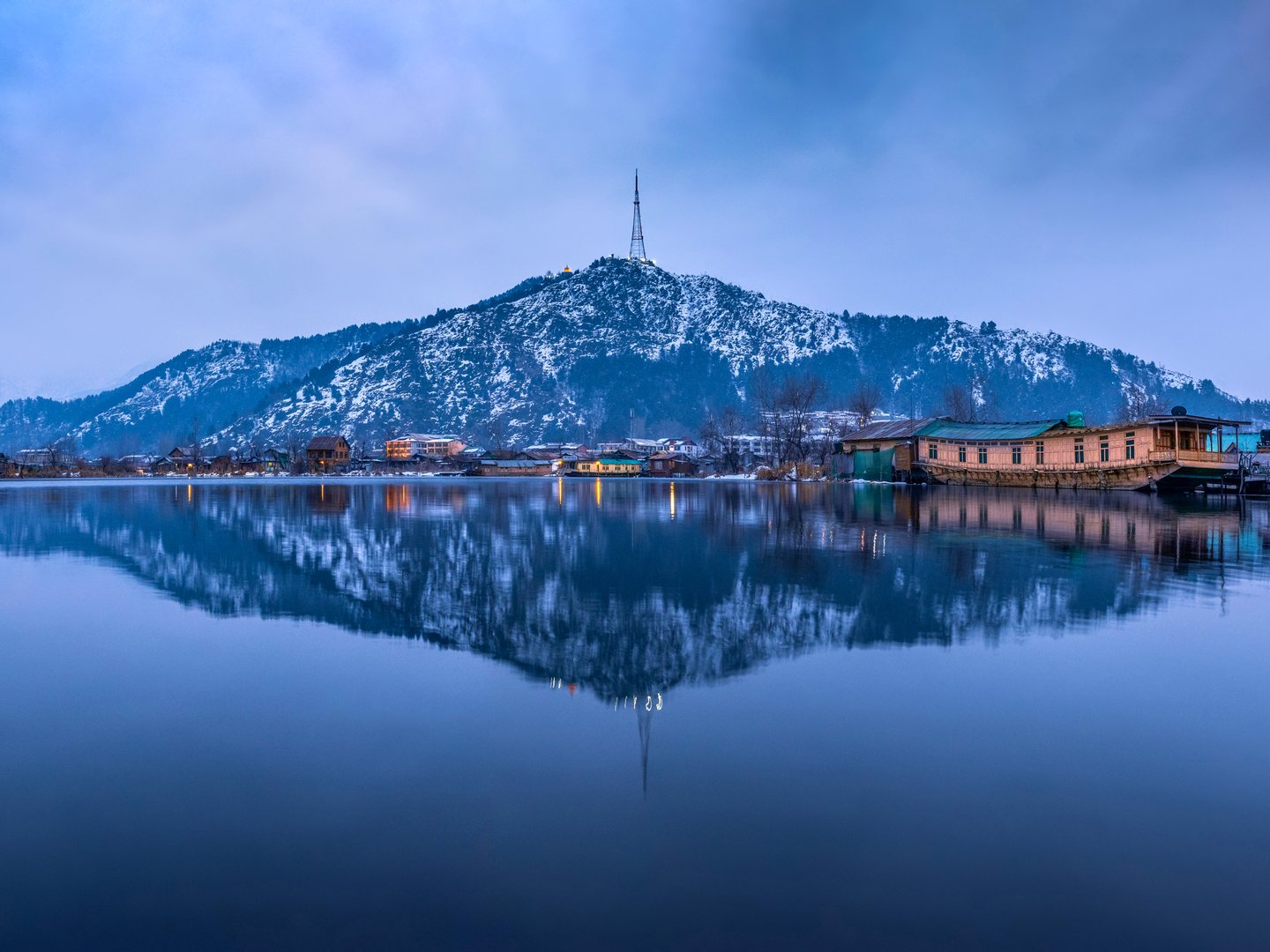 Mountain reflections in Lake Dal in winter