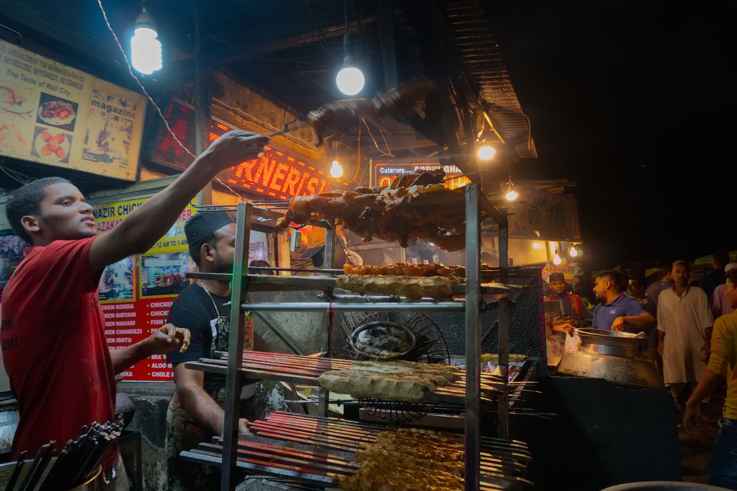 Street vendors cooking kebabs in Delhi