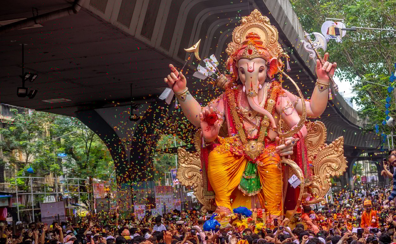 Thousands of people say goodbye Lord Ganesha with colors in Mumbai during Ganesh Visarjan which marks the end of the Ganesh Chaturthi festival.