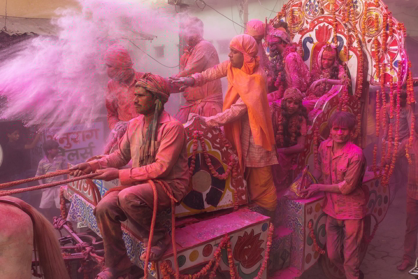 Colourful Holi procession on the streets of Vrindavan, Uttar Pradesh, India. 