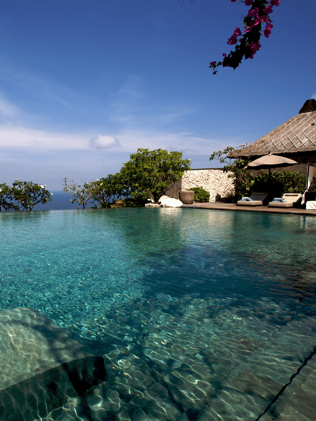View over an infinity-pool at a resort in Bal