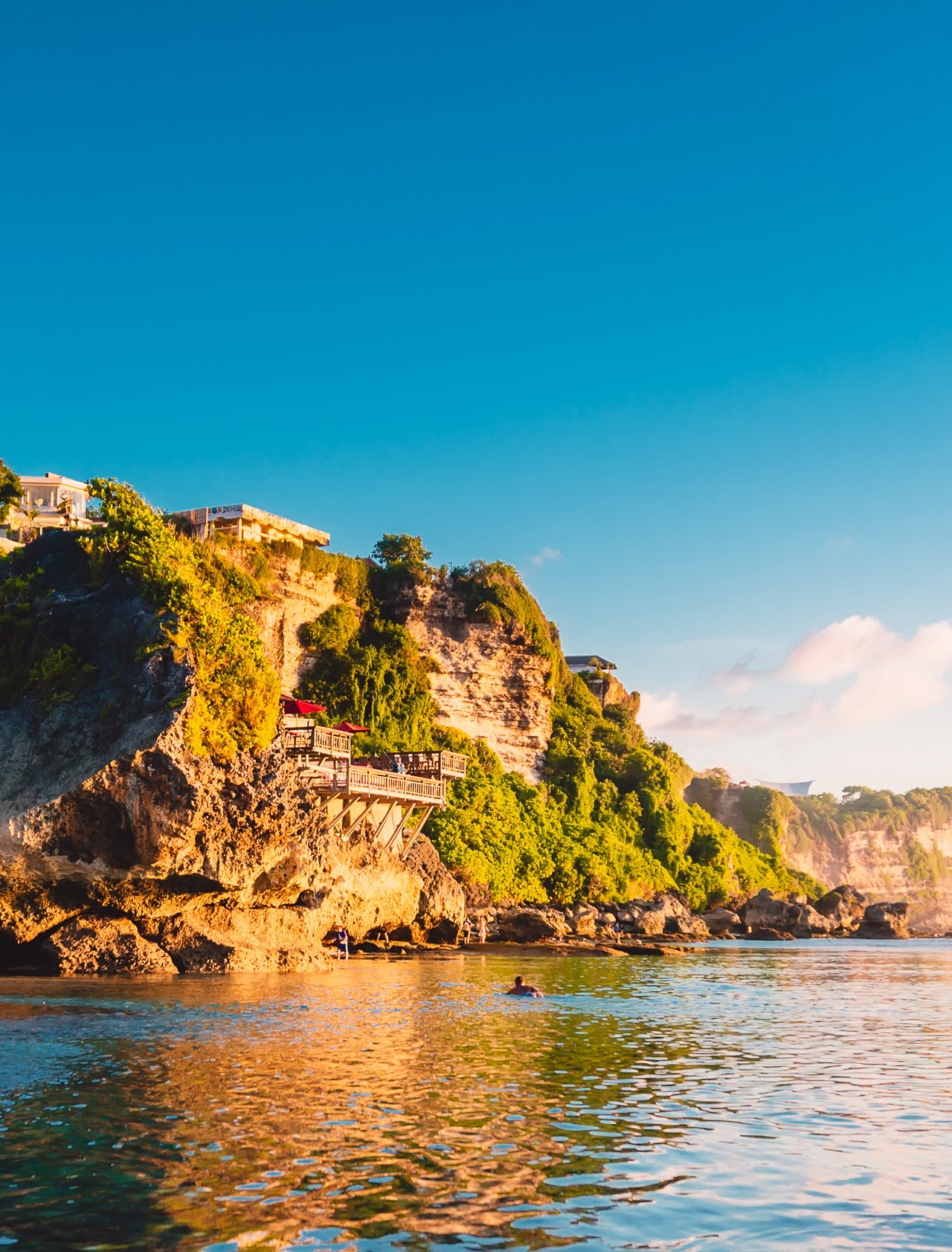 Blue sky, ocean and rocky cliff in Uluwatu, Bali