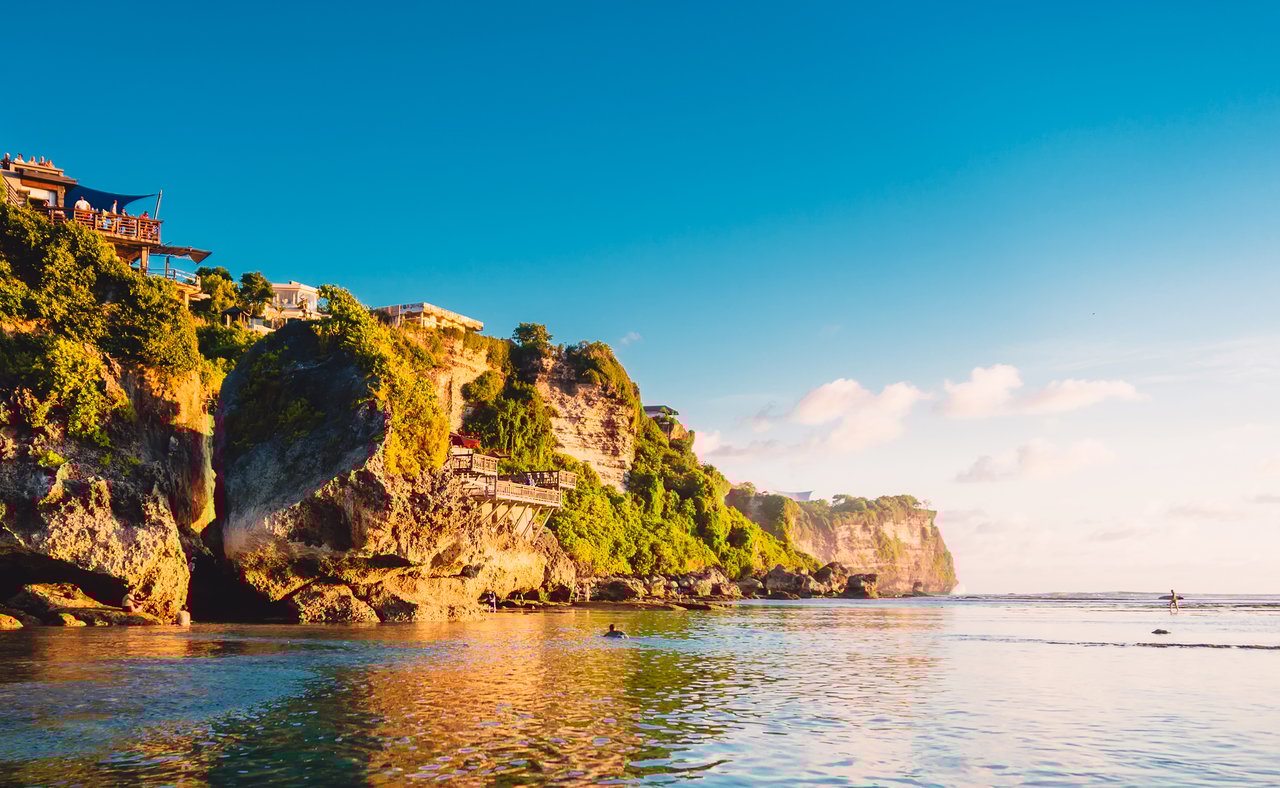 Blue sky, ocean and rocky cliff in Uluwatu, Bali