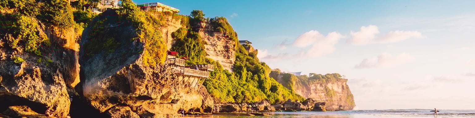 Blue sky, ocean and rocky cliff in Uluwatu, Bali