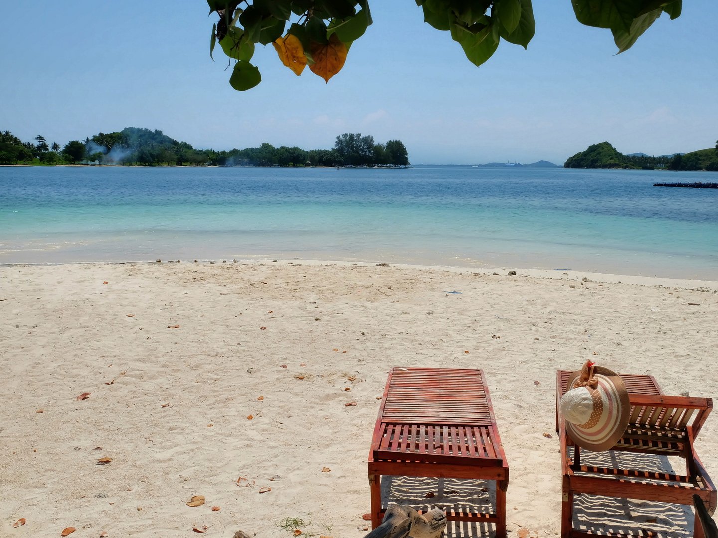 Loungers on the beach at Gili Sudak, Indonesia