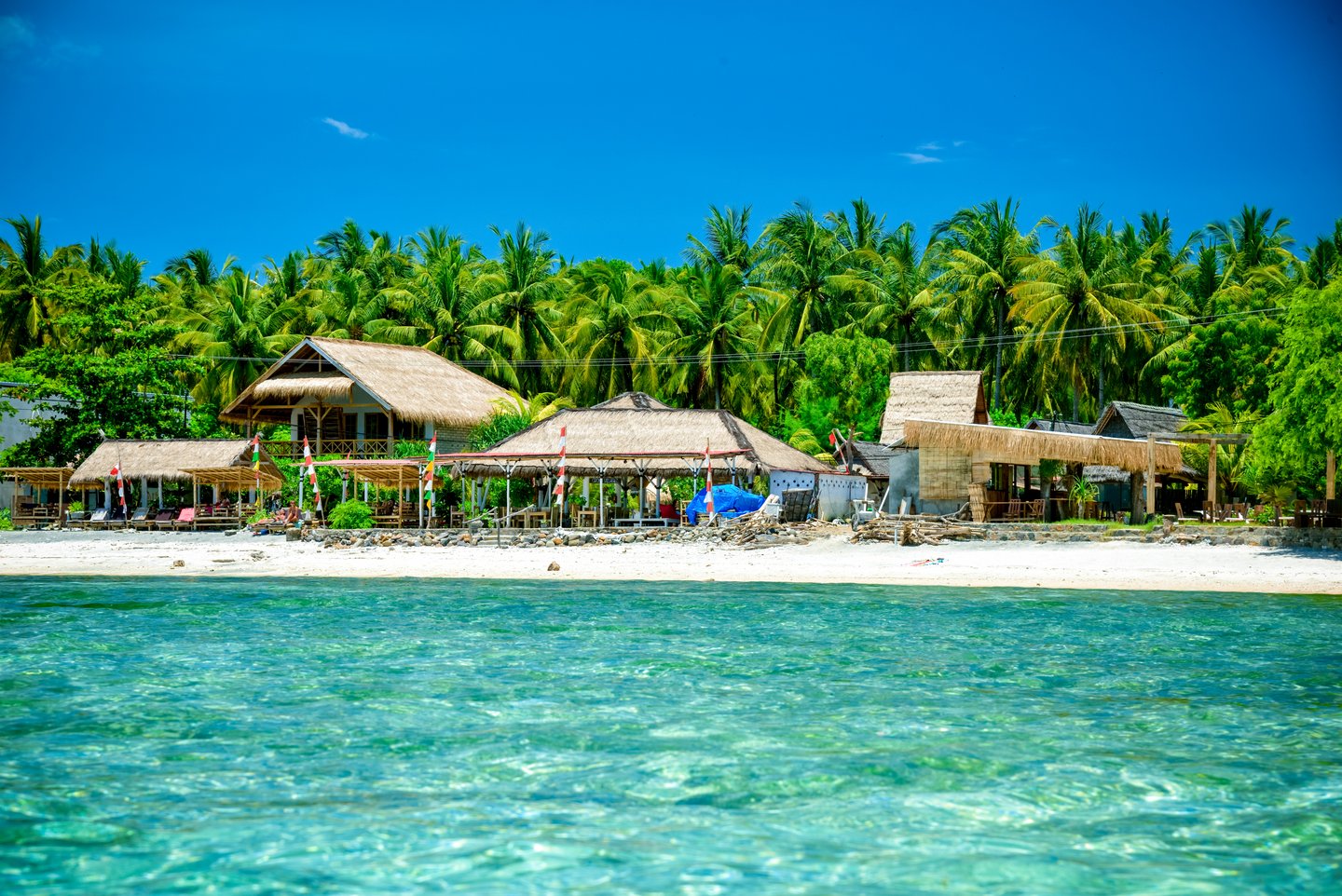 Loungers and bungalows on the beach at Weh Island