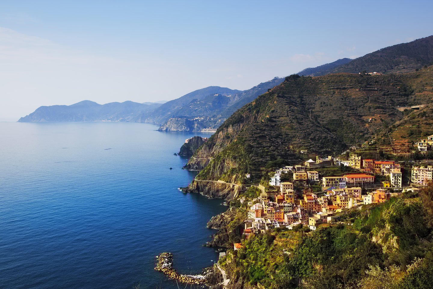 An aerial view of Riomaggiore and Via dell Amore in the Cinque Terre National Park