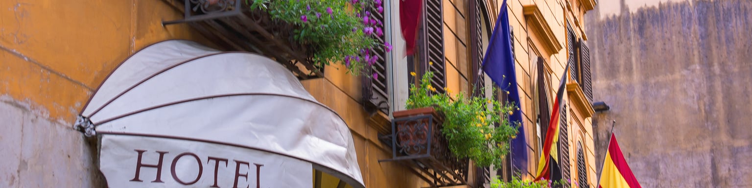 Flags displayed outside a hotel in Italy.