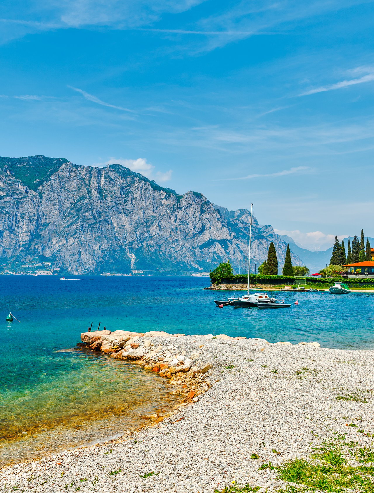 A beach on Lake Garda in Italy in the summer.