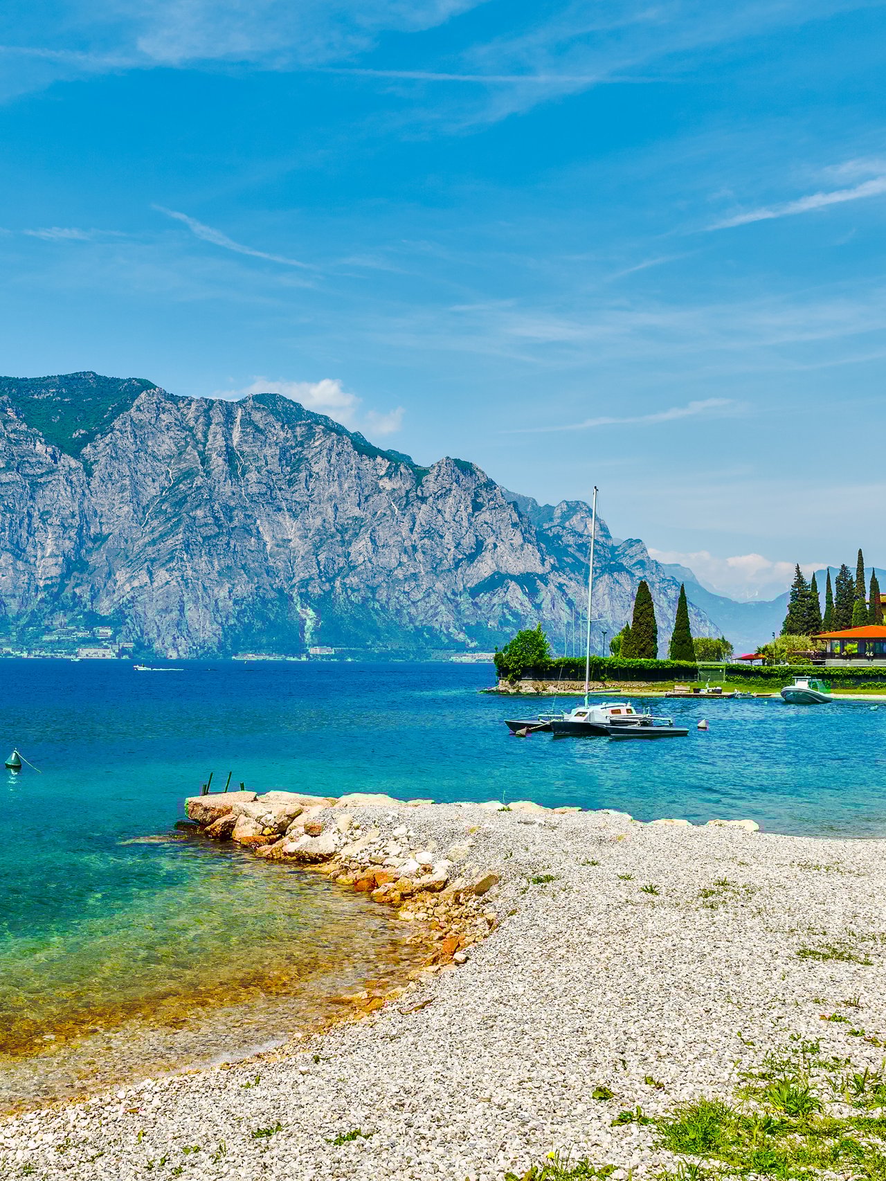 A beach on Lake Garda in Italy in the summer.
