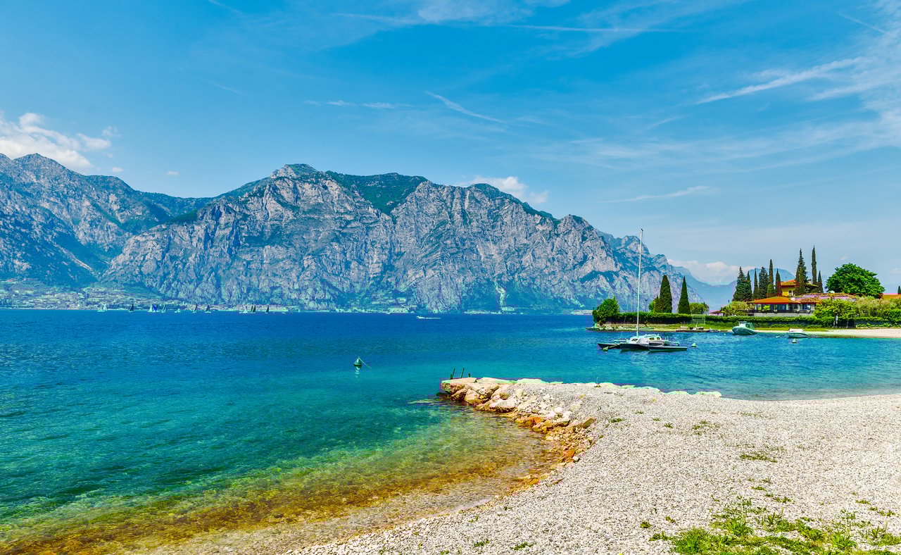 A beach on Lake Garda in Italy in the summer.