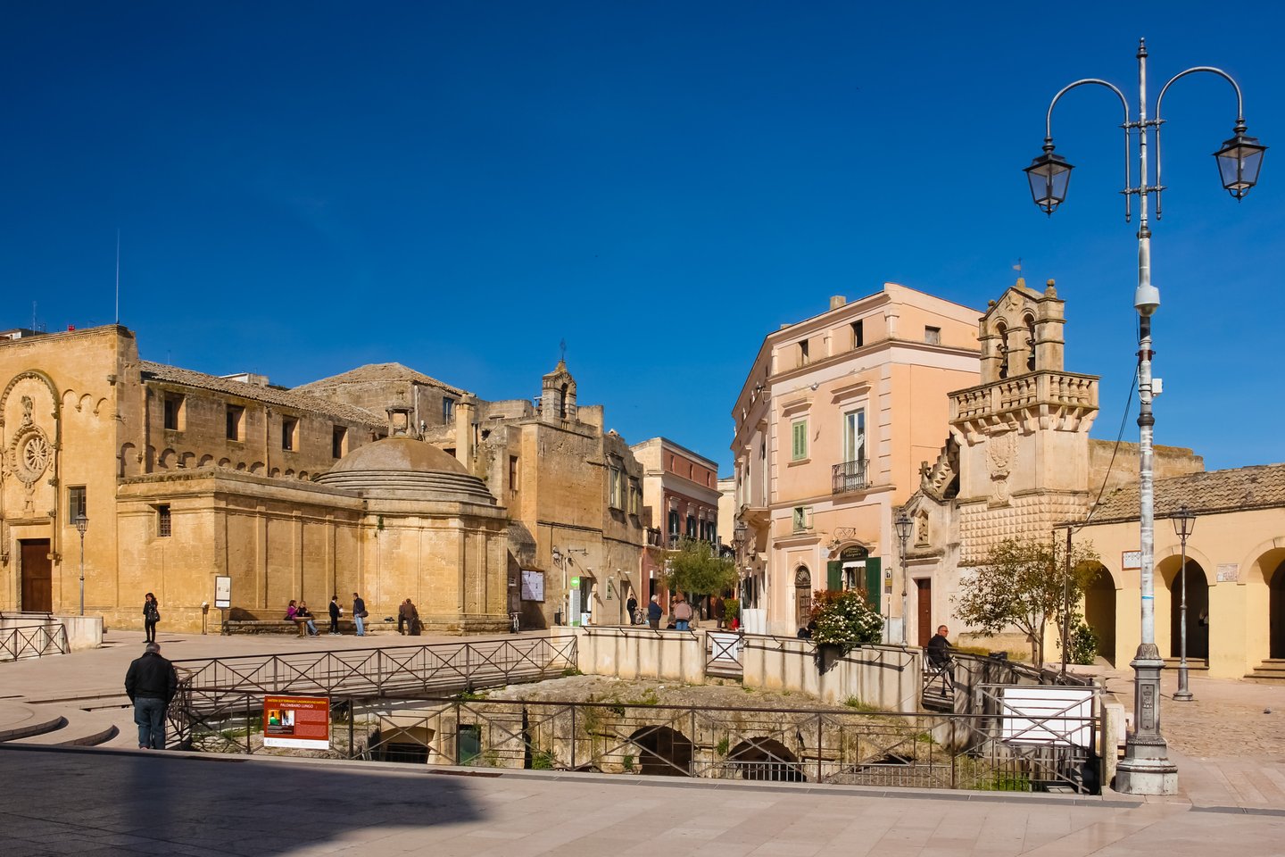 The arches of the cistern Palombaro Lungo visible under the Piazza Vittorio Veneto in Matera, Italy