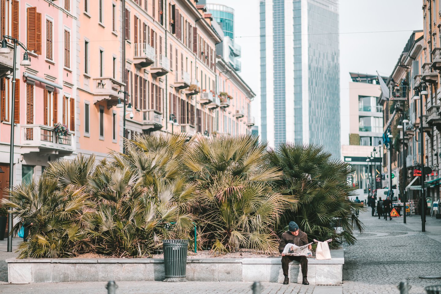 A main reading the paper in Milan, Italy