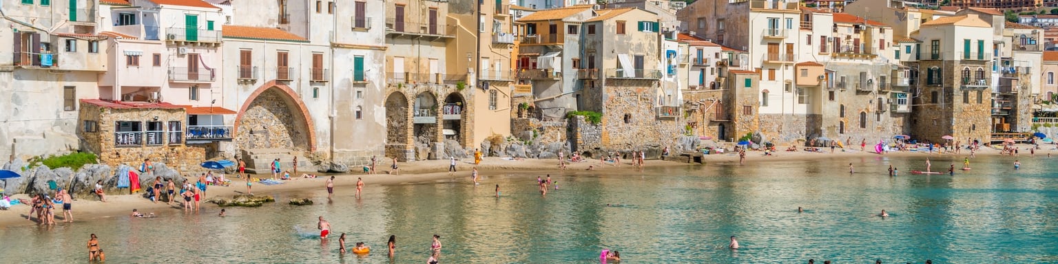 The picturesque Cefalu waterfront on a sunny summer day 