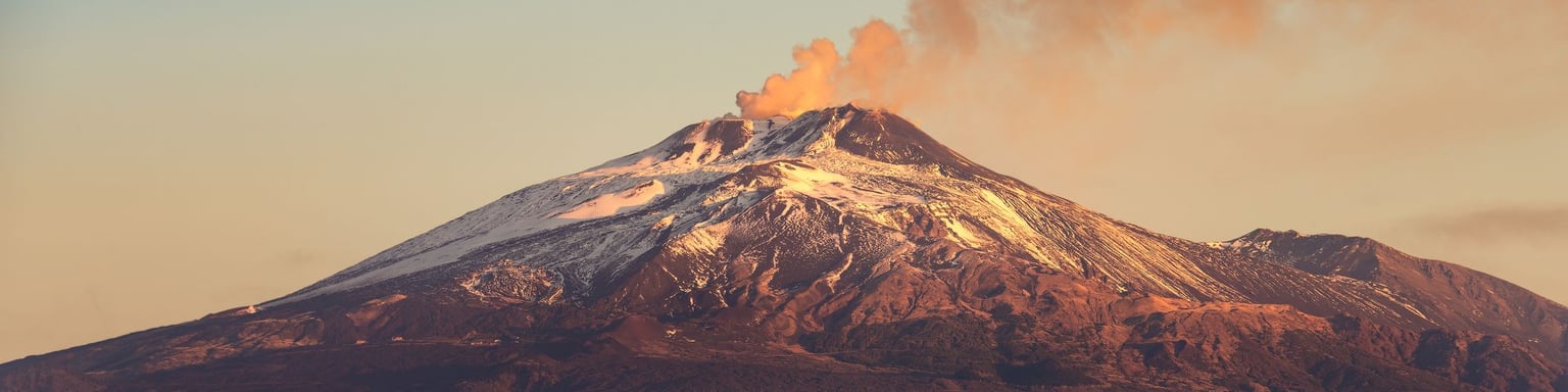 Smoke coming out of Mt Etna at sunset