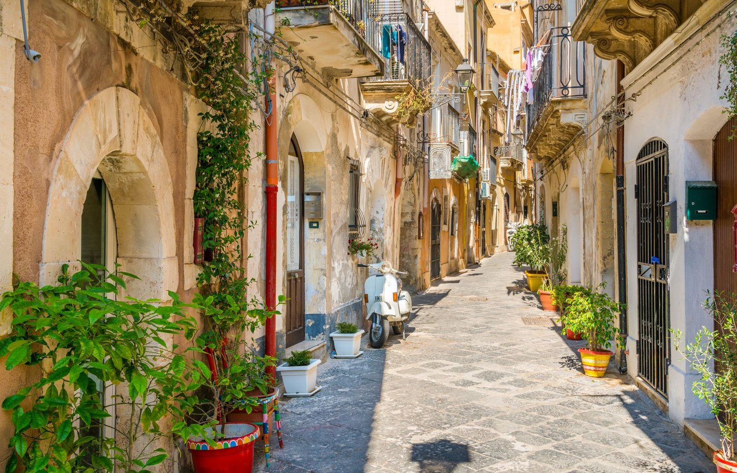 A narrow and picturesque road in Ortigia, Siracuse old town, Sicily,