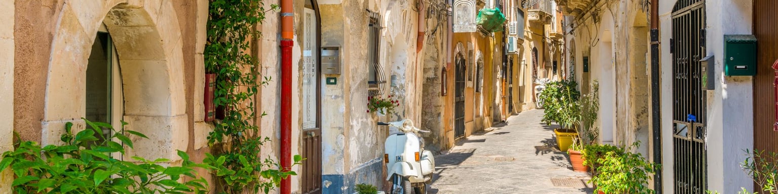 A narrow and picturesque road in Ortigia, Siracuse old town, Sicily,