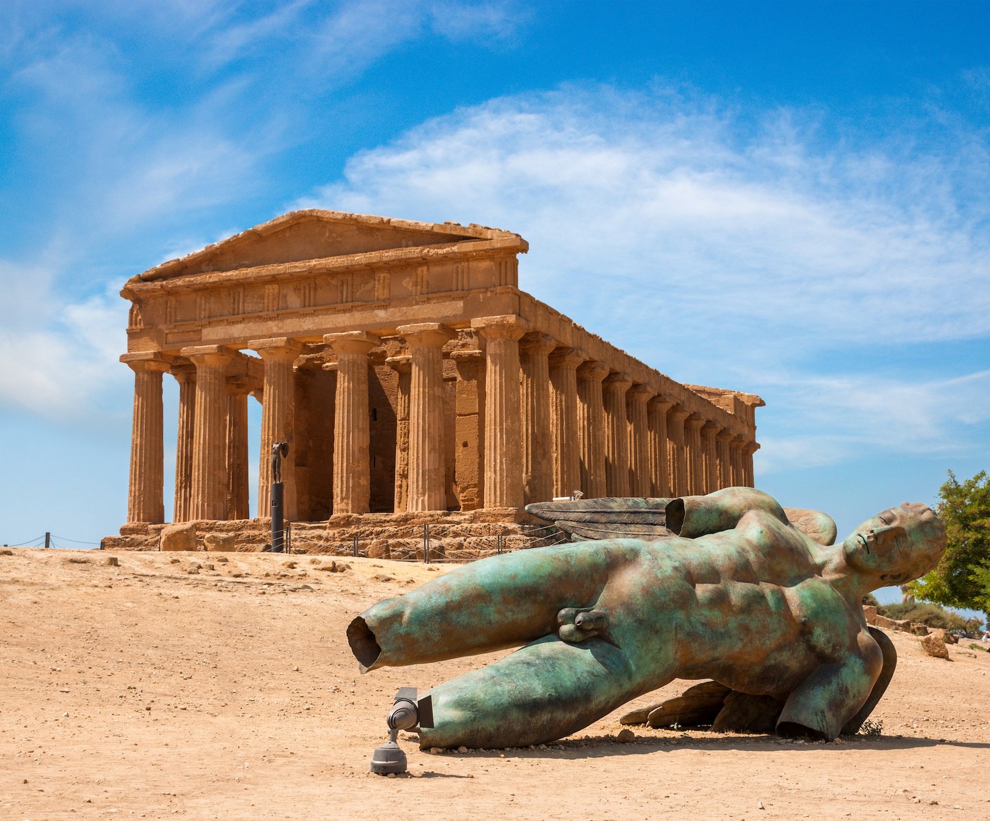 Concordia Temple and a bronze statue of Icarus at the Valley of the Temples in Sicily
