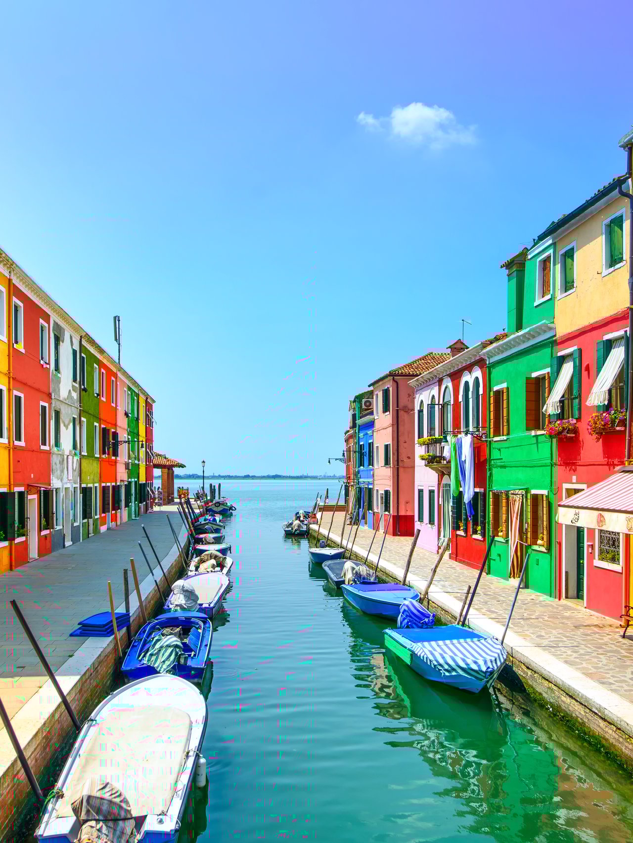 Colourful houses along a canal in Burano, Venice.