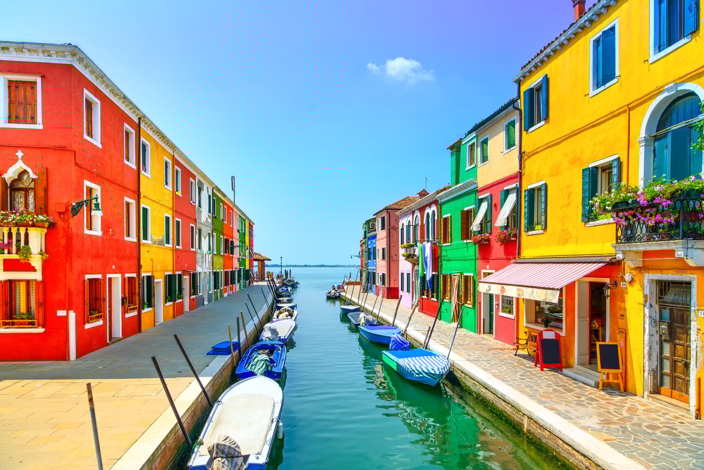 Colourful houses along a canal in Burano, Venice.