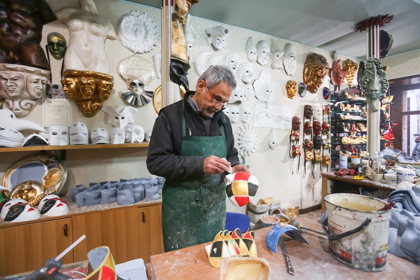 A man making Carnival masks in Venice, Italy.