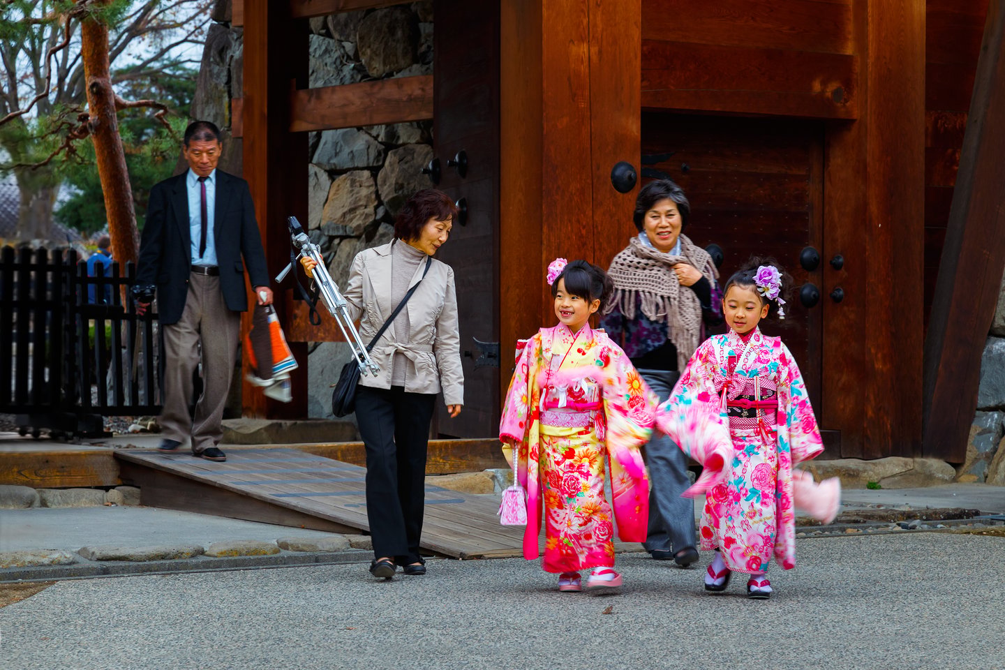 A family celebrating Shichi-Go-San at Atsuta Shrine in Japan.
